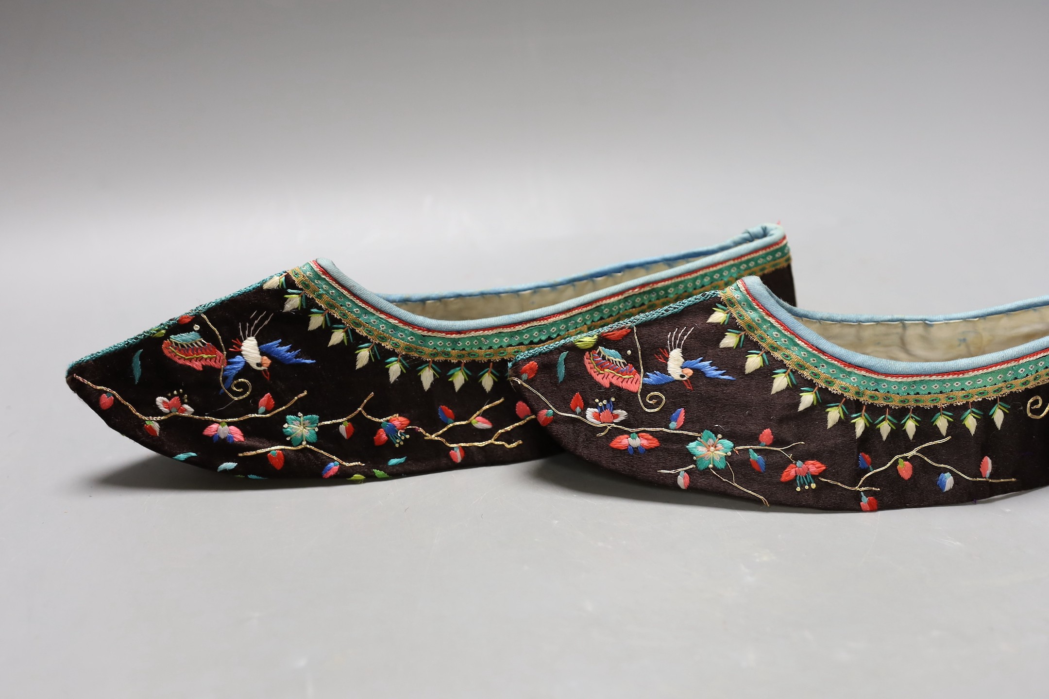 A pair of Chinese embroidered silk shoes, upper section only